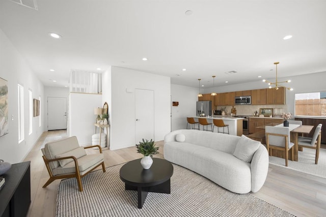 2210 Bonita Ct, Lemon Grove, CA 91945 - living area with light wood finished floors and recessed lighting