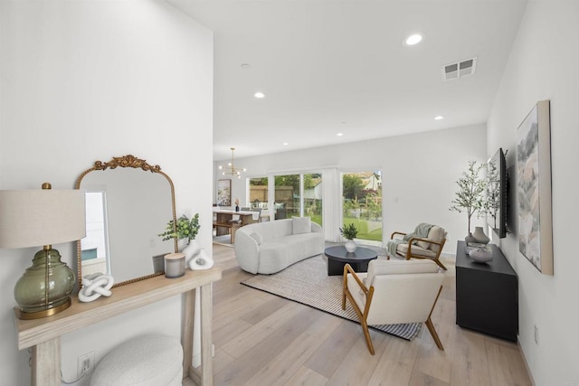 2210 Bonita Ct, Lemon Grove, CA 91945 - living room with light wood-style floors, recessed lighting, and a chandelier