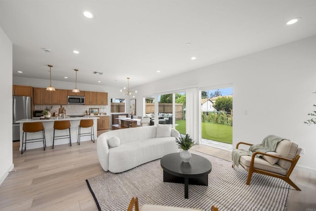 2210 Bonita Ct, Lemon Grove, CA 91945 - living area featuring recessed lighting, light wood finished floors, and baseboards