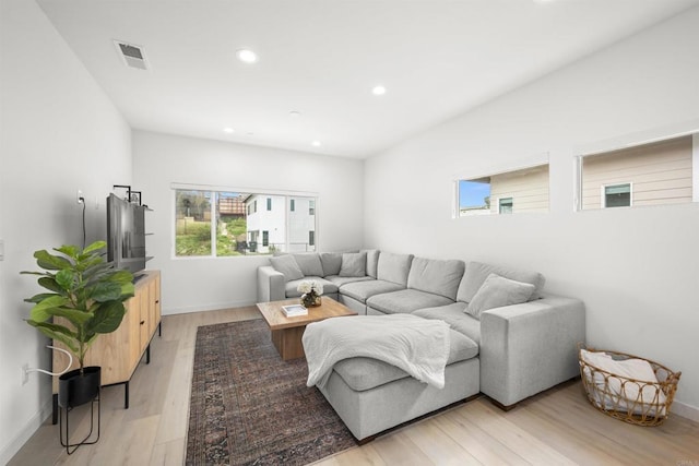 2210 Bonita Ct, Lemon Grove, CA 91945 - living room with recessed lighting, light wood-style floors, and baseboards