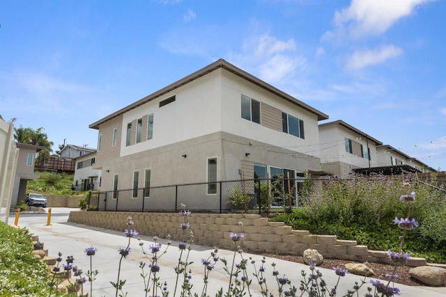 2210 Bonita Ct, Lemon Grove, CA 91945 - view of side of home with fence and stucco siding