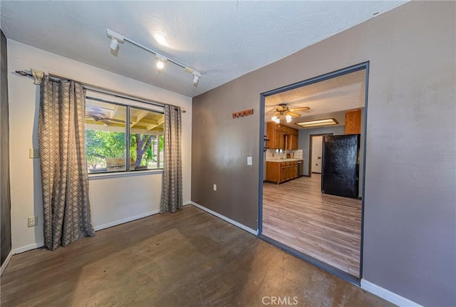 43096 Deer Trail Way, Coarsegold, CA 93614 - spare room featuring baseboards, wood finished floors, and ceiling fan