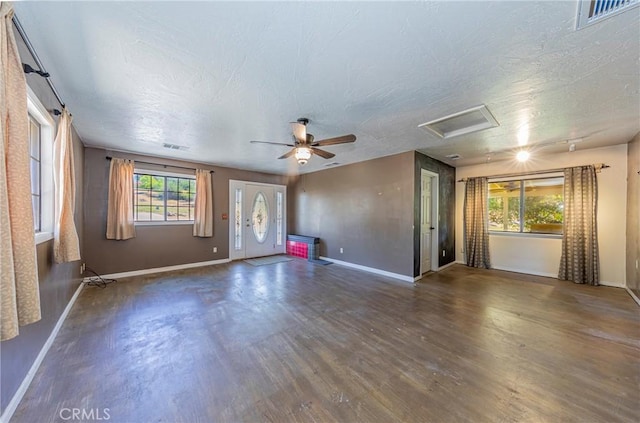 43096 Deer Trail Way, Coarsegold, CA 93614 - unfurnished living room featuring attic access, baseboards, and a textured ceiling
