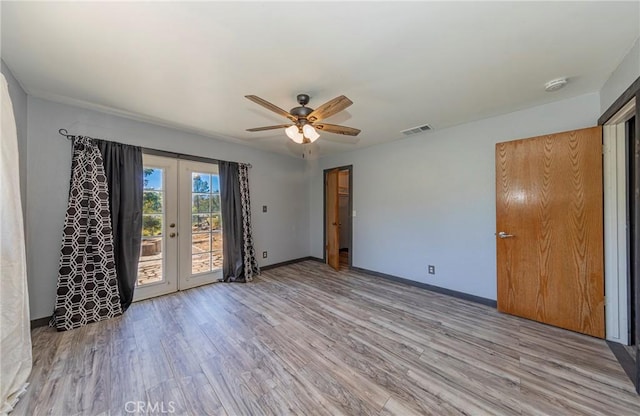 43096 Deer Trail Way, Coarsegold, CA 93614 - empty room with french doors, wood finished floors, a ceiling fan, and baseboards