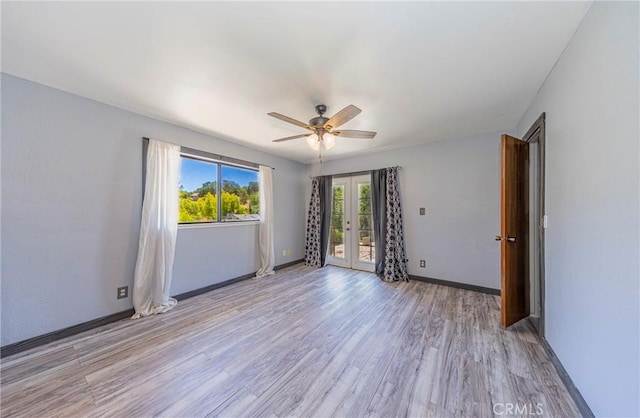 43096 Deer Trail Way, Coarsegold, CA 93614 - unfurnished room featuring french doors, light wood-type flooring, a ceiling fan, and baseboards