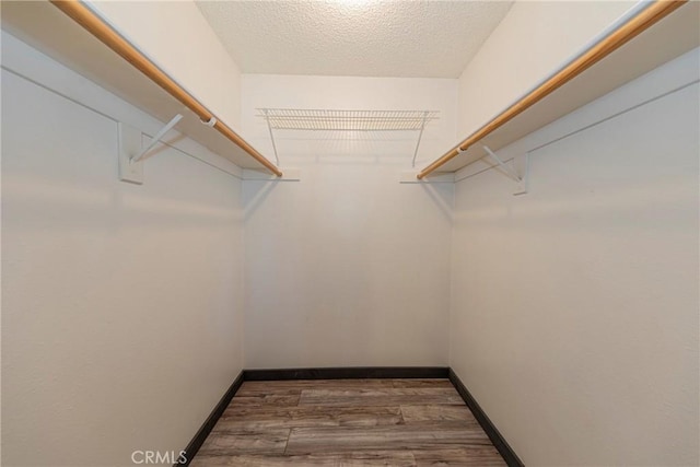 43096 Deer Trail Way, Coarsegold, CA 93614 - walk in closet featuring wood finished floors
