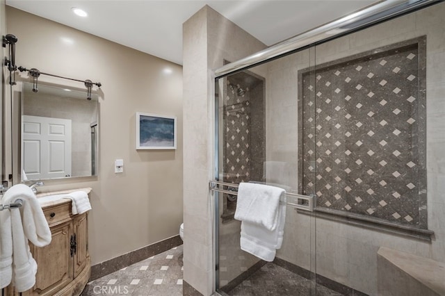 full bathroom with a shower stall, vanity, recessed lighting, toilet, and granite floors