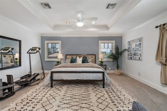 carpeted bedroom with a tray ceiling, baseboards, crown molding, a ceiling fan, and recessed lighting