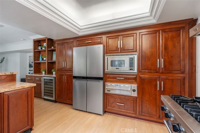 kitchen with appliances with stainless steel finishes, wine cooler, open shelves, light wood finished floors, and ornamental molding