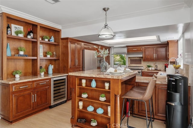 kitchen featuring open shelves, wine cooler, ornamental molding, a sink, and decorative light fixtures
