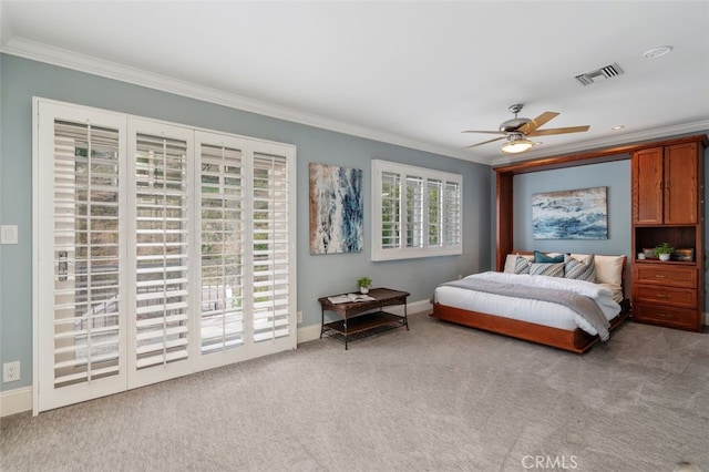 carpeted bedroom featuring crown molding, access to exterior, baseboards, and ceiling fan