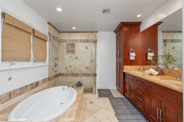 full bath with a stall shower, a garden tub, tile patterned floors, double vanity, and recessed lighting