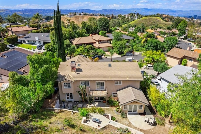 aerial view of residential area with mountains