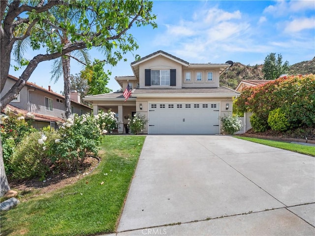 28042 Cascade Rd, Castaic, CA 91384 - traditional-style house featuring an attached garage, driveway, a front lawn, and stucco siding