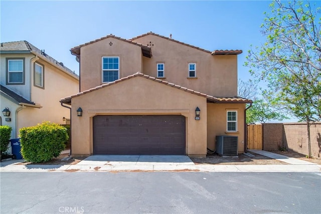 3933 E Bethany Way, Ontario, CA 91761 - mediterranean / spanish house featuring stucco siding, a tiled roof, and cooling unit