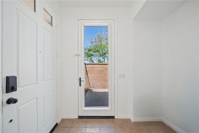 3933 E Bethany Way, Ontario, CA 91761 - doorway to outside featuring light tile patterned floors and baseboards