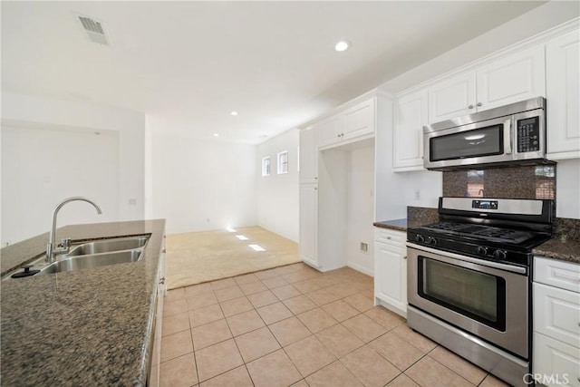 3933 E Bethany Way, Ontario, CA 91761 - kitchen featuring appliances with stainless steel finishes, a sink, white cabinets, and recessed lighting