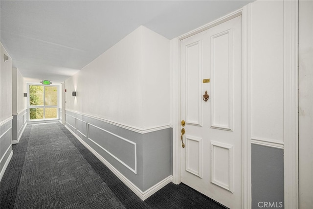 448 N Bellflower Blvd Unit 119, Long Beach, CA 90814 - hall with dark colored carpet and wainscoting