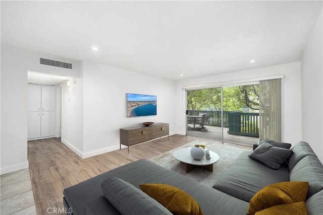 448 N Bellflower Blvd Unit 119, Long Beach, CA 90814 - living room featuring baseboards, wood finished floors, and recessed lighting