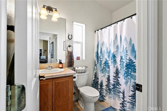 full bath with toilet, vanity, curtained shower, and tile patterned flooring