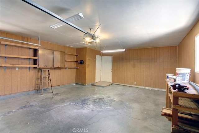 221 E Barker Blvd, Big Bear City, CA 92314 - garage with a garage door opener and wood walls