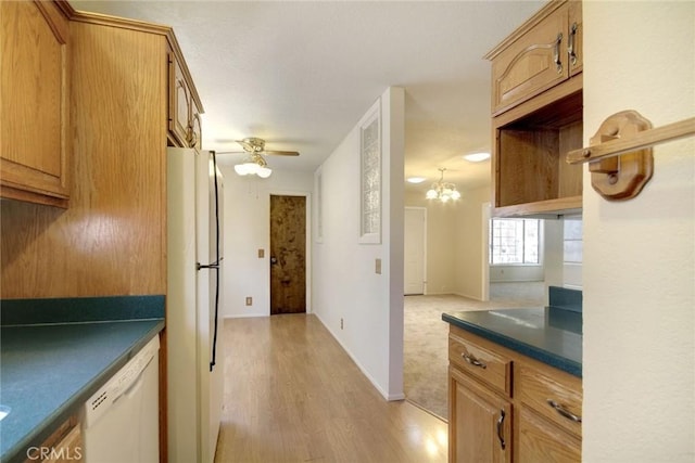 221 E Barker Blvd, Big Bear City, CA 92314 - kitchen with white appliances, light wood-style flooring, dark countertops, a ceiling fan, and brown cabinetry