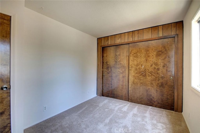 221 E Barker Blvd, Big Bear City, CA 92314 - unfurnished bedroom featuring carpet floors and wood walls