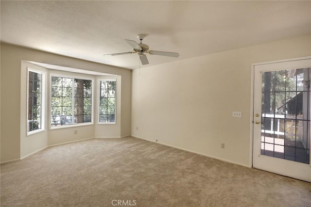 221 E Barker Blvd, Big Bear City, CA 92314 - spare room featuring plenty of natural light, carpet flooring, and ceiling fan