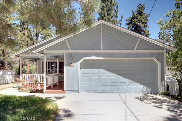221 E Barker Blvd, Big Bear City, CA 92314 - view of front of house with driveway, a garage, and covered porch