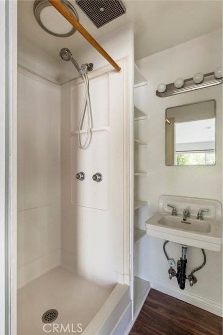 808 El Redondo Ave, Redondo Beach, CA 90277 - bathroom featuring a shower stall, wood finished floors, and a sink