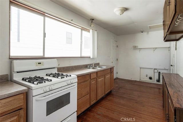 808 El Redondo Ave, Redondo Beach, CA 90277 - kitchen featuring white range with gas cooktop, a sink, dark wood finished floors, open shelves, and brown cabinetry