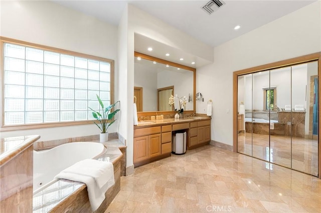 3277 Barhite St, Pasadena, CA 91107 - bathroom featuring double vanity, a tub with jets, recessed lighting, and baseboards