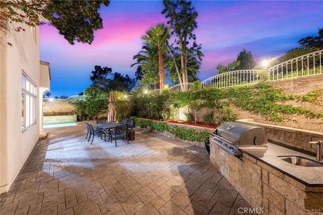 3277 Barhite St, Pasadena, CA 91107 - patio terrace at dusk featuring a sink, a patio, and outdoor dining area