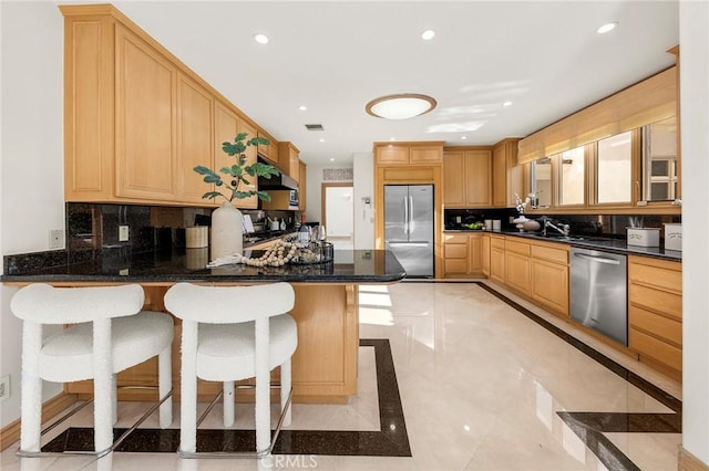 3277 Barhite St, Pasadena, CA 91107 - kitchen with appliances with stainless steel finishes, a peninsula, backsplash, a kitchen bar, and recessed lighting