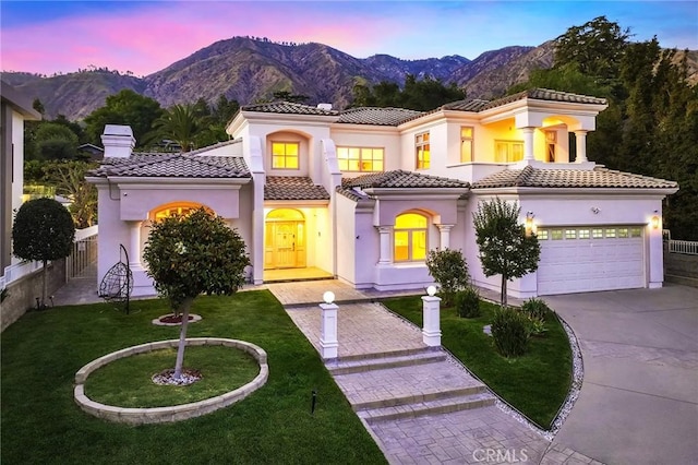 3277 Barhite St, Pasadena, CA 91107 - mediterranean / spanish-style home featuring a mountain view, driveway, a tile roof, a chimney, and a garage
