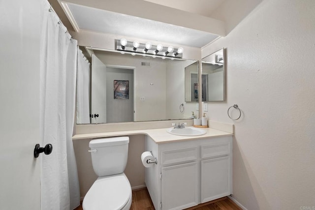 9560 Frank Way, Santee, CA 92071 - bathroom featuring toilet, vanity, and wood finished floors