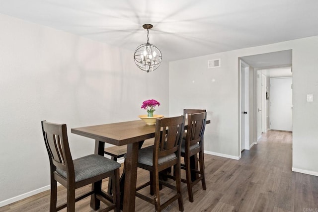 9560 Frank Way, Santee, CA 92071 - dining space featuring a chandelier, wood finished floors, and baseboards