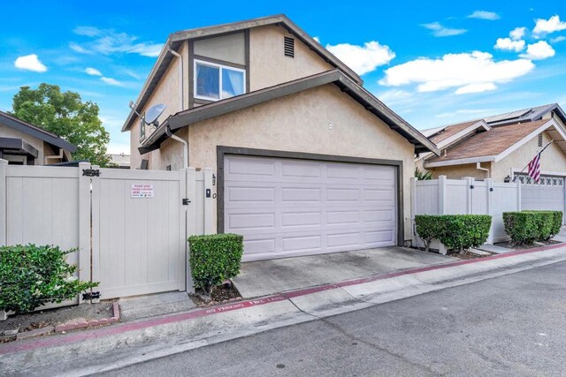 9560 Frank Way, Santee, CA 92071 - view of front of house with a gate, stucco siding, fence, and concrete driveway