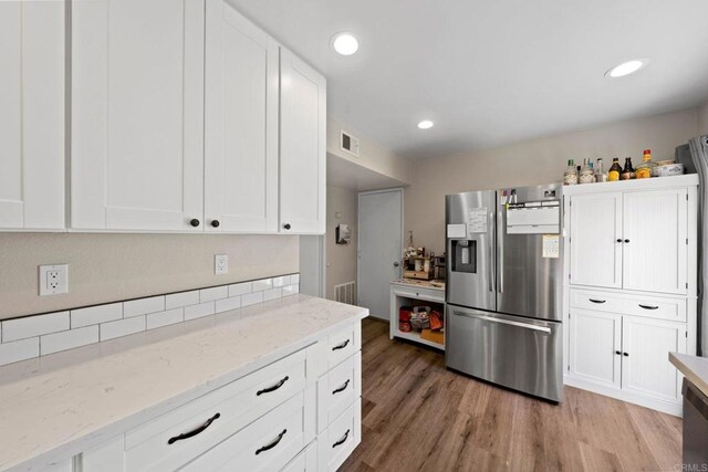 9560 Frank Way, Santee, CA 92071 - kitchen featuring stainless steel refrigerator with ice dispenser, light wood finished floors, white cabinetry, light stone counters, and recessed lighting