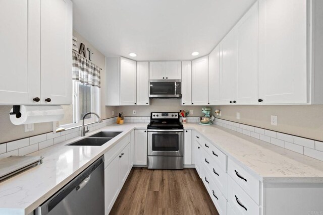 9560 Frank Way, Santee, CA 92071 - kitchen with stainless steel appliances, a sink, white cabinetry, recessed lighting, and light stone counters