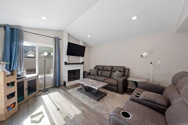 9560 Frank Way, Santee, CA 92071 - living room with light wood-style floors, vaulted ceiling, a fireplace, and recessed lighting