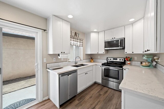 9560 Frank Way, Santee, CA 92071 - kitchen featuring stainless steel appliances, white cabinets, dark wood finished floors, recessed lighting, and healthy amount of natural light