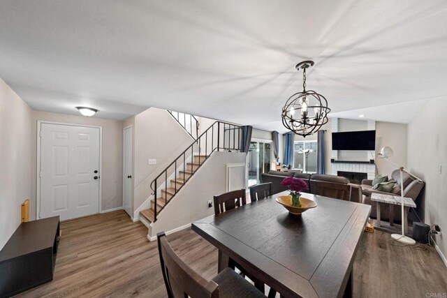 9560 Frank Way, Santee, CA 92071 - dining area with stairway, wood finished floors, and a chandelier