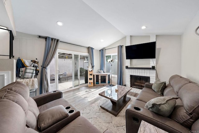 9560 Frank Way, Santee, CA 92071 - living area featuring wood finished floors, a brick fireplace, lofted ceiling, and recessed lighting
