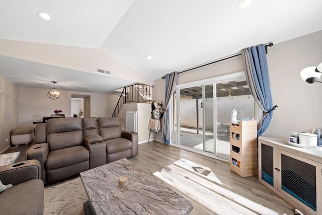 9560 Frank Way, Santee, CA 92071 - living area featuring lofted ceiling, wood finished floors, stairs, recessed lighting, and a chandelier