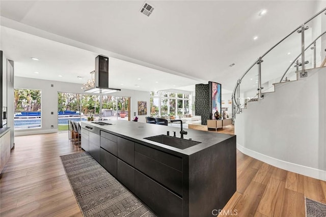 18782 Peppertree Dr, Villa Park, CA 92861 - kitchen with modern cabinets, a sink, open floor plan, baseboards, and recessed lighting