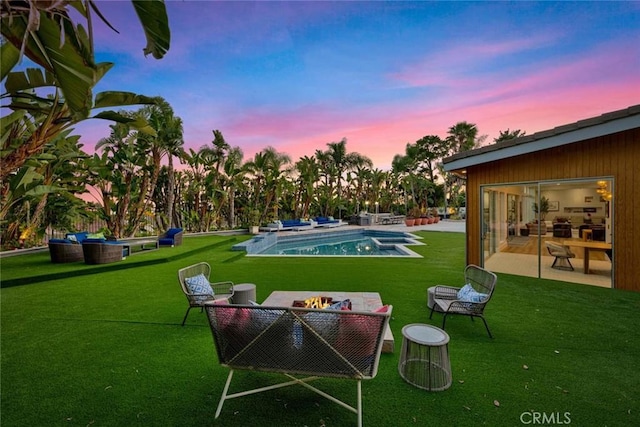18782 Peppertree Dr, Villa Park, CA 92861 - yard at dusk featuring a patio, an outdoor pool, a lawn, and an outdoor fire pit