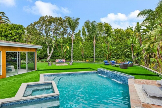 18782 Peppertree Dr, Villa Park, CA 92861 - view of pool featuring a lawn, a pool with connected hot tub, view of wooded area, and a patio