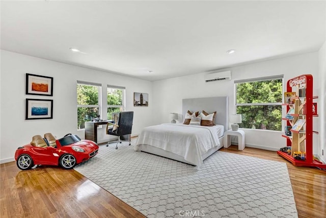 18782 Peppertree Dr, Villa Park, CA 92861 - bedroom featuring a wall unit AC, wood finished floors, baseboards, and recessed lighting