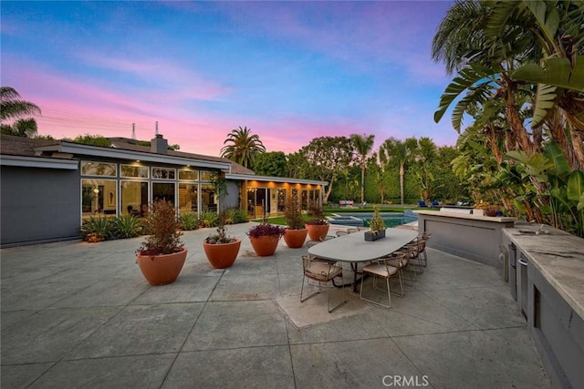 18782 Peppertree Dr, Villa Park, CA 92861 - view of patio featuring an outdoor pool and an outdoor kitchen
